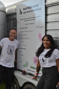 Panther M*lk founder Paul Crawford and a colleague next to their menu