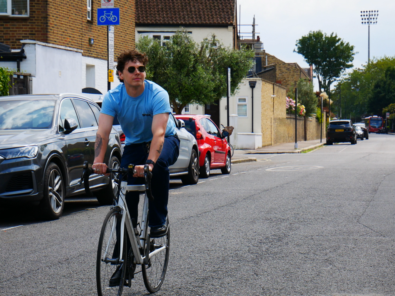 man riding a bicycle on the road 