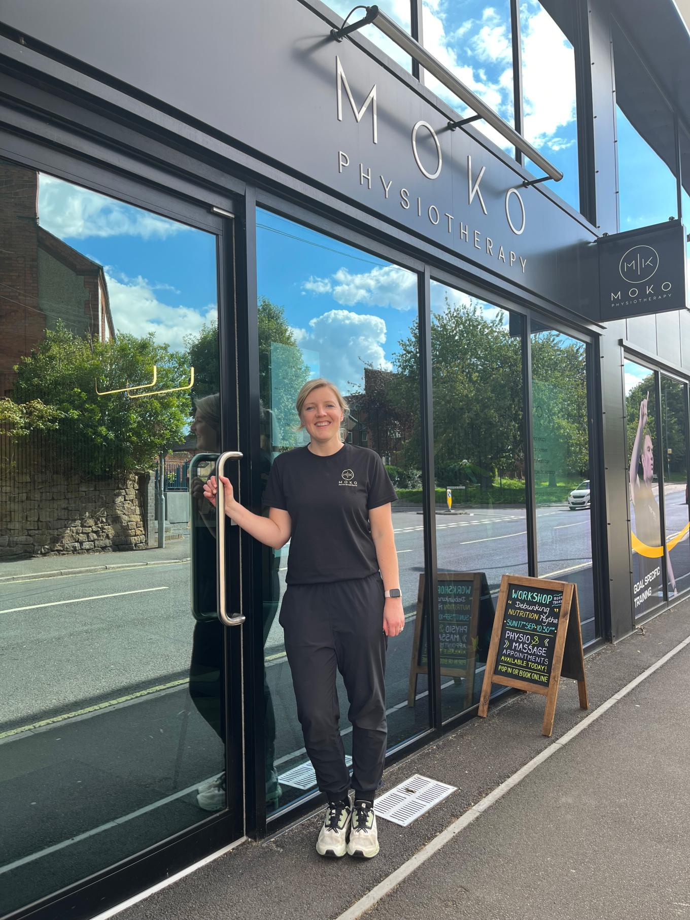 Founder and Director, Katie Ogley standing outside her physiotherapy and sports massage clinic Moko Physiotherapy