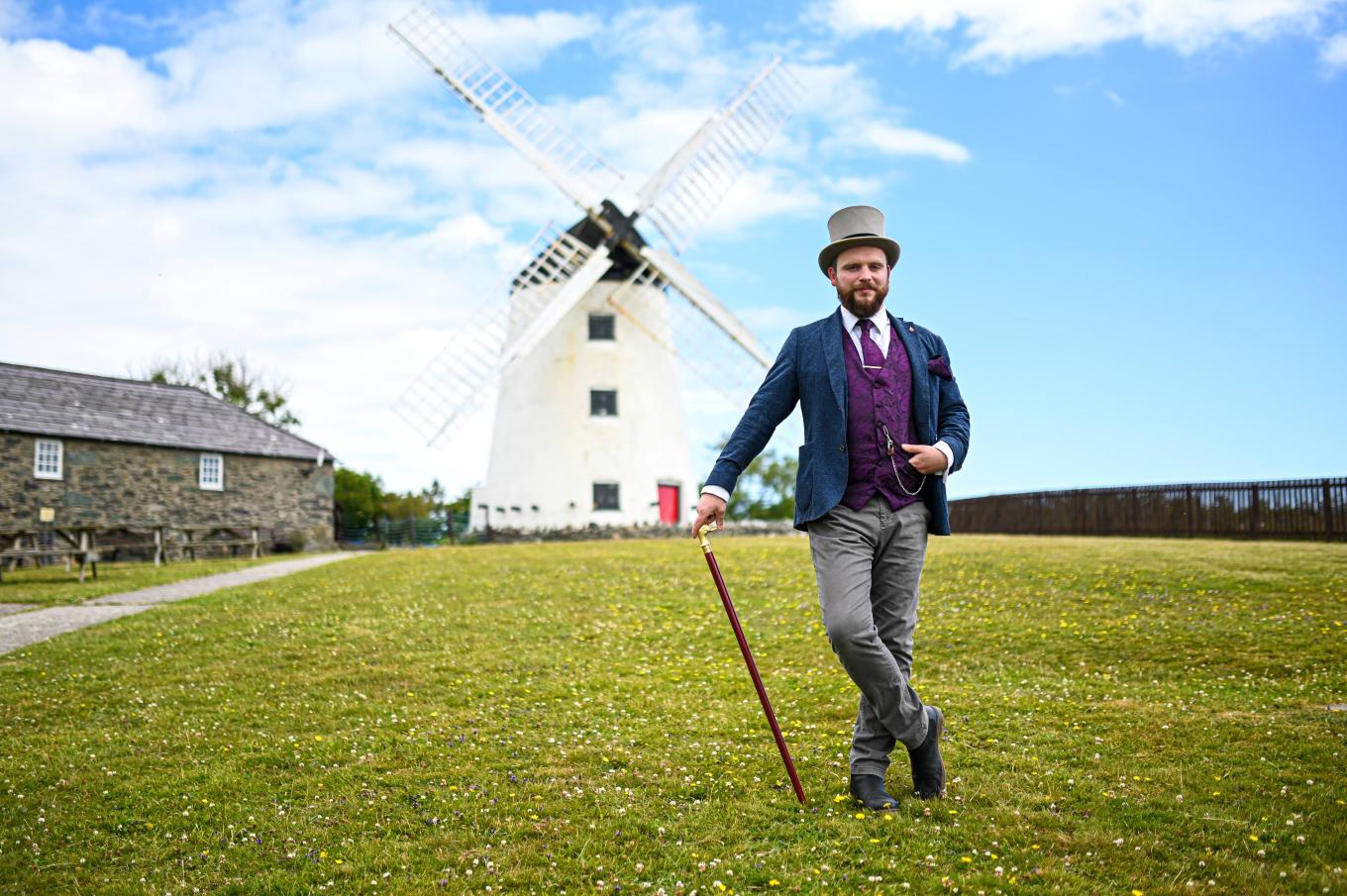 Melin Llynon windmill, Ynys Môn with owner Richard Holt in the foreground