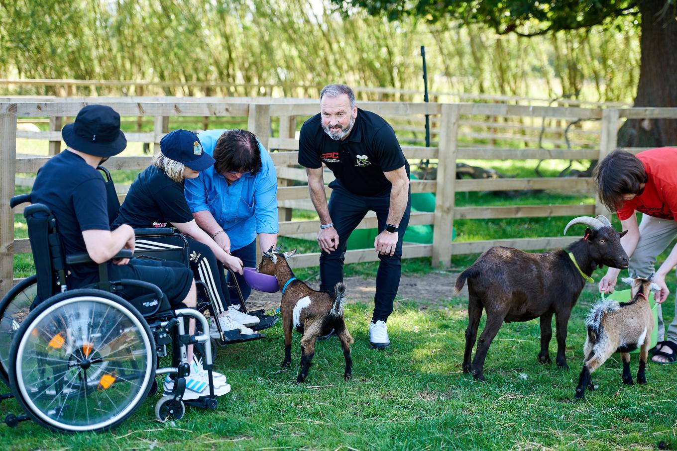 Paul Connaughton, founder of JPC Specialist Motorsports at his community farm with children and pets