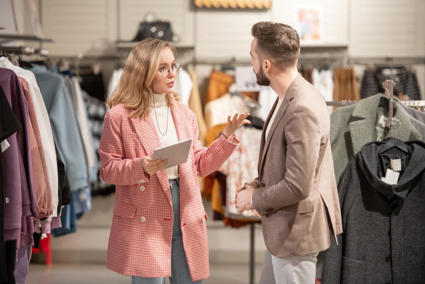 Woman asking a man questions in a retail store